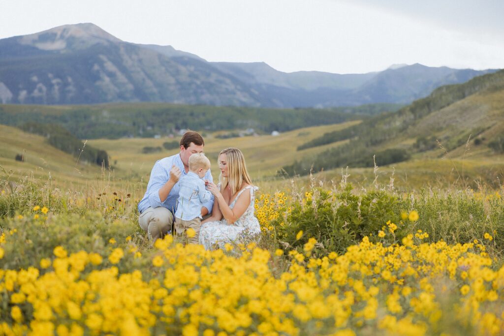 natural family interaction in wildflowers in Mt Crested Butte Colorado