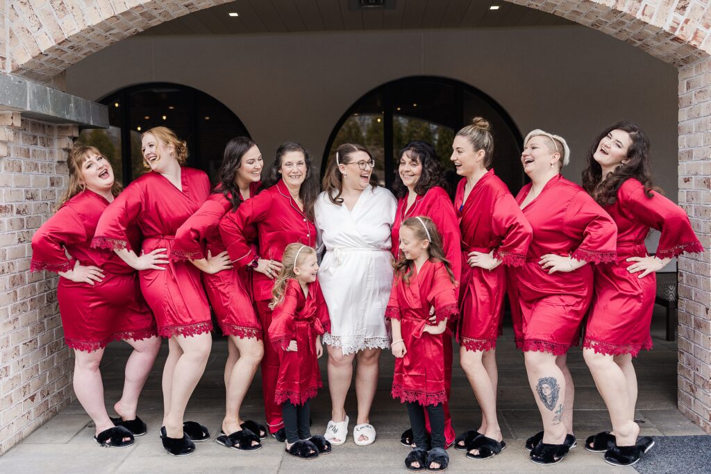 bridesmaids and moms on wedding day
bridesmaids in robes
burgundy robes for bridesmaids
bridesmaids and flower girls
outdoor robe photo
