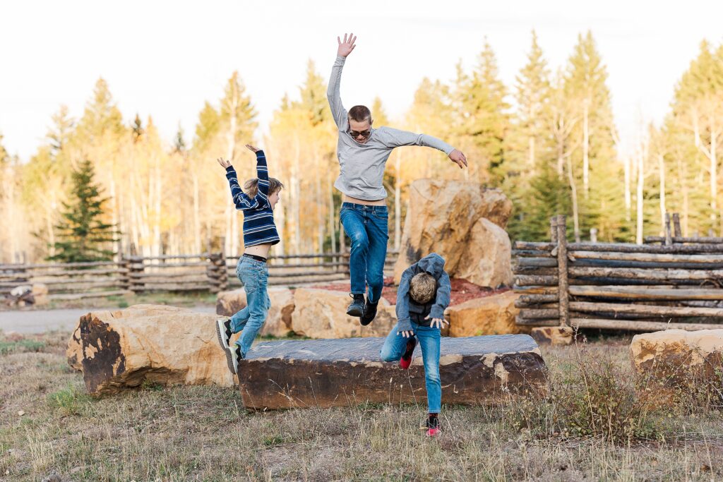 golden aspen family photos
brothers laughing in fall trees
davewood road family session
golden aspens in western colorado
family portraits with fall colors