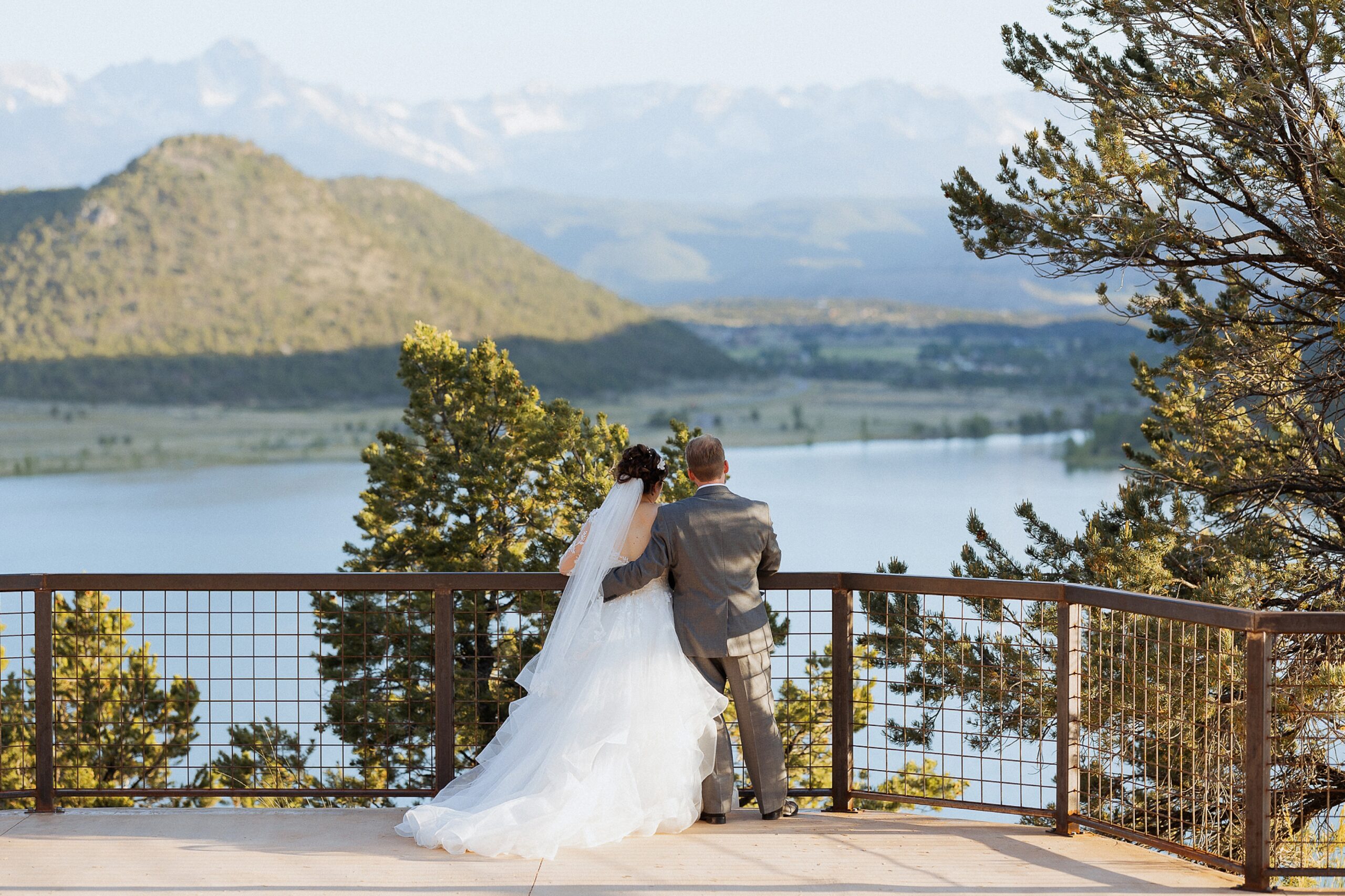 Ridgway State Park wedding photos with bride and groom overlooking lake and mountains
