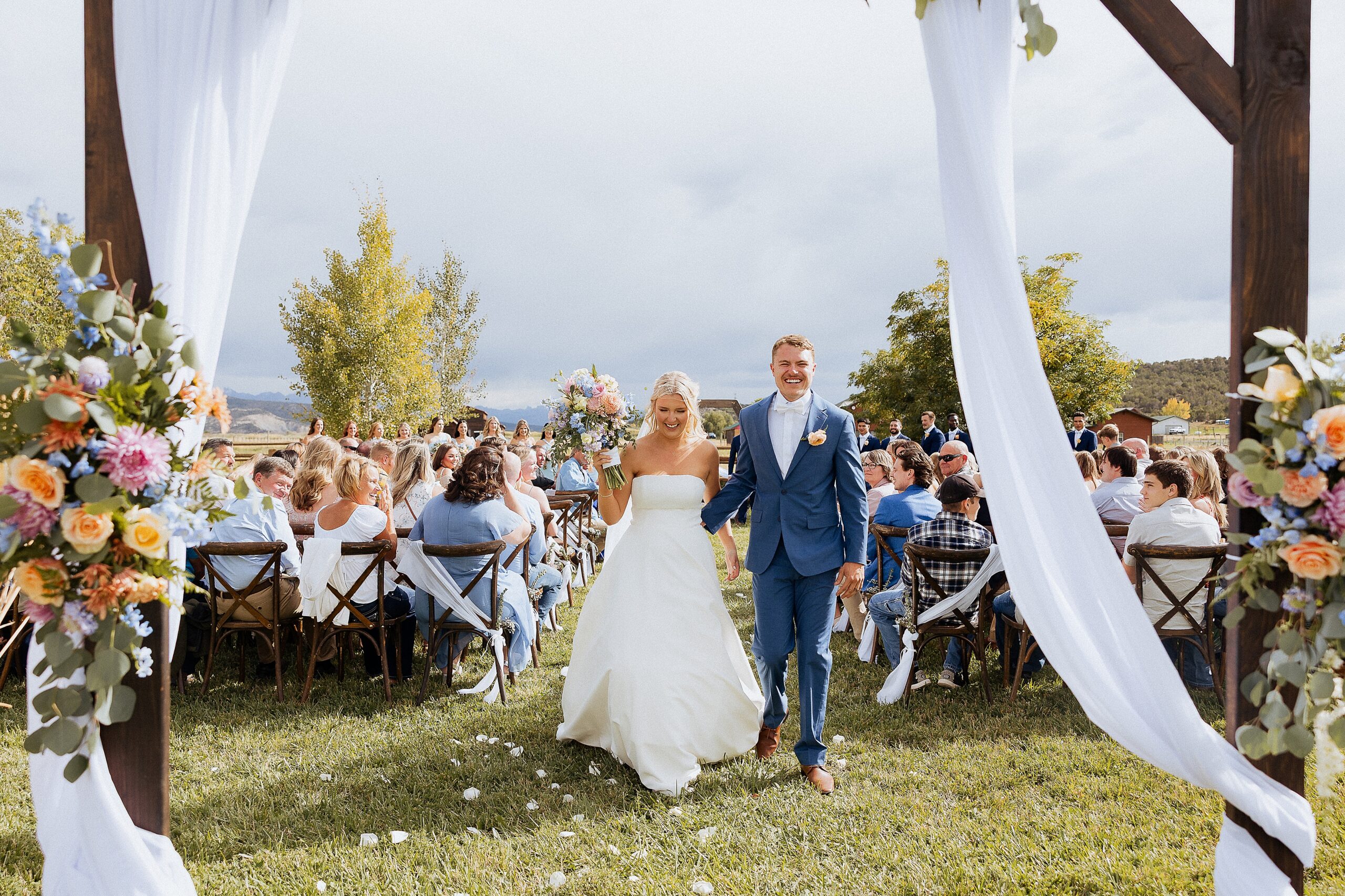 wedding ceremony exit in Ridgway Colorado with bride and groom walking down aisle