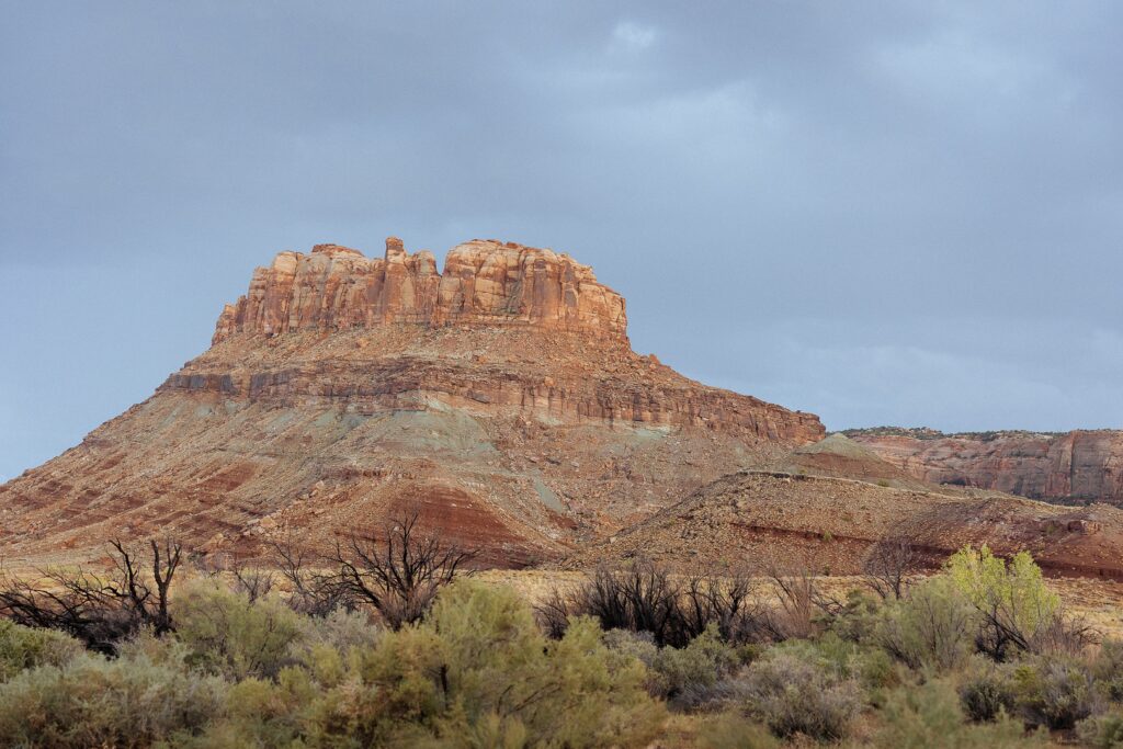 Moab wedding photos at Red Earth Venue with desert mountain views
Red Earth Venue wedding in Moab Utah with couple at sunset
Moab desert wedding photos with red rock landscape
wedding at Red Earth Venue Moab with scenic canyon backdrop