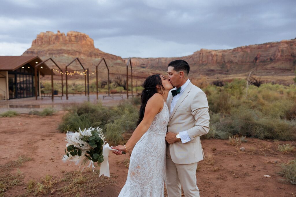 couple in warm desert sunset light during Moab wedding