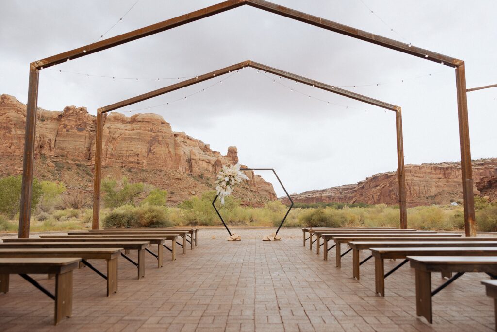 Moab Utah wedding with red rock cliffs and desert views
outdoor wedding ceremony at Red Earth Venue in Moab Utah
couple exchanging vows at Red Earth Venue Moab
Moab desert ceremony with guests and red rock backdrop