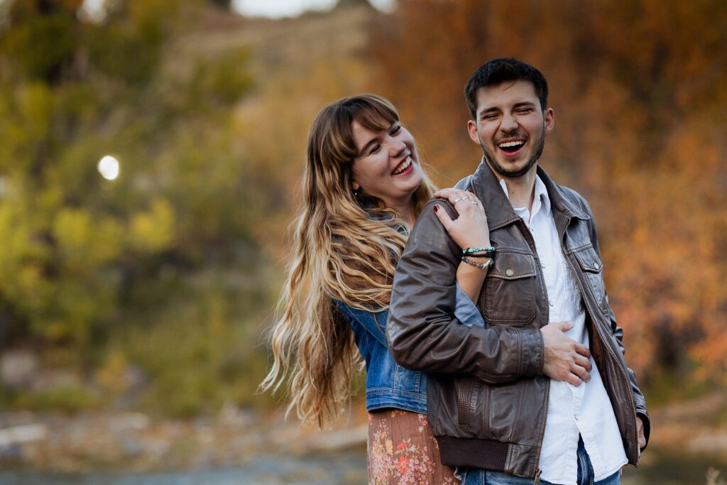 fun engagement photos with playful couple in Ridgway Colorado

couple laughing during engagement session at Dennis Weaver Park

candid engagement photos in Ridgway Colorado