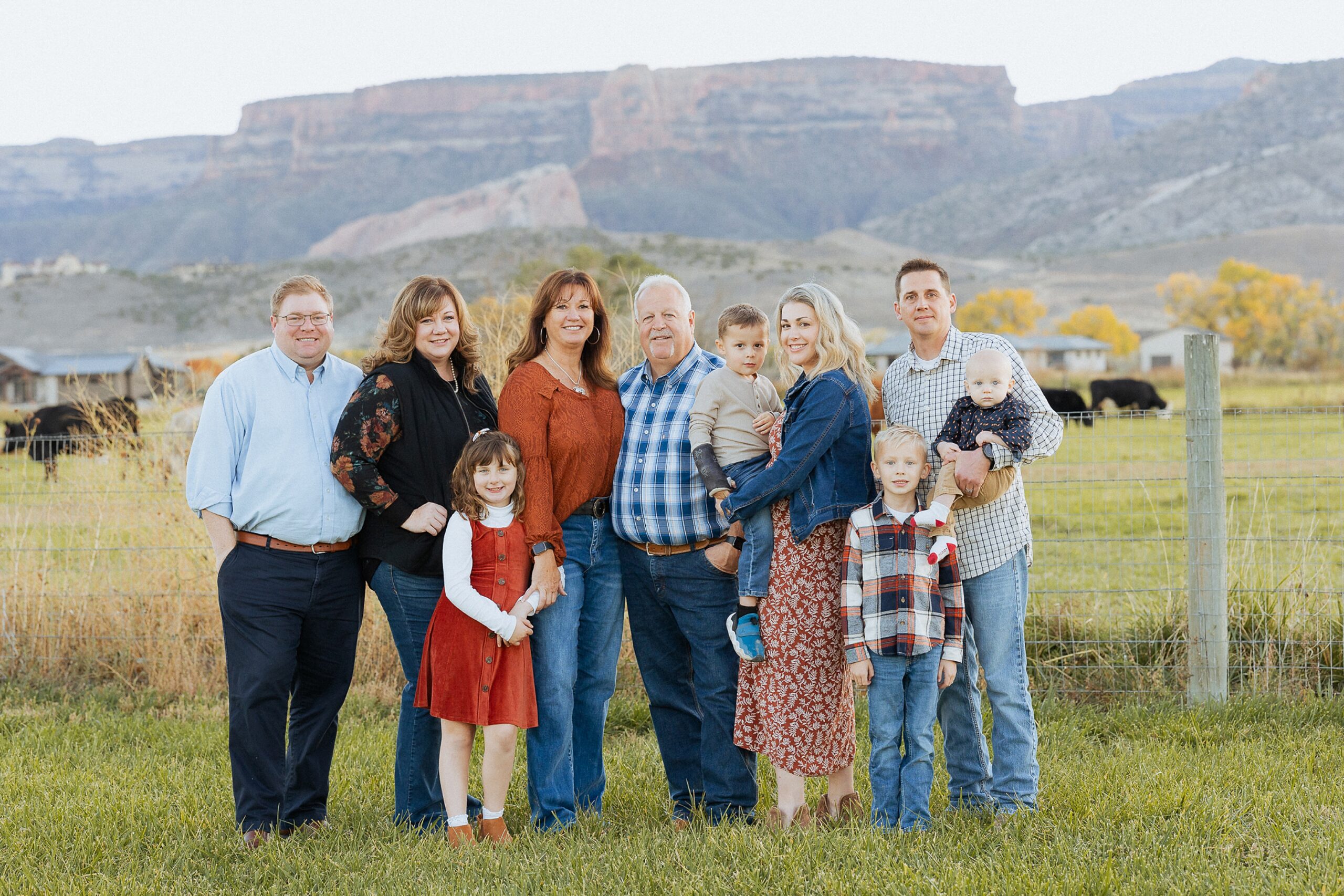 Christensen family posing in front of the Colorado National Monument near Fruita Colorado during a fall family session